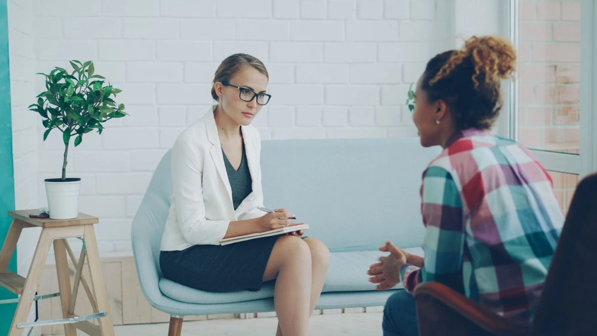 Psychologist talking with a client during a counseling session